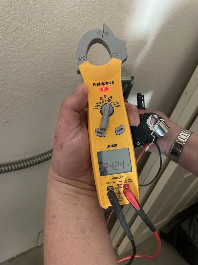 Voltage testing with clamp meter during Circuit Breaker Repair in Bolton